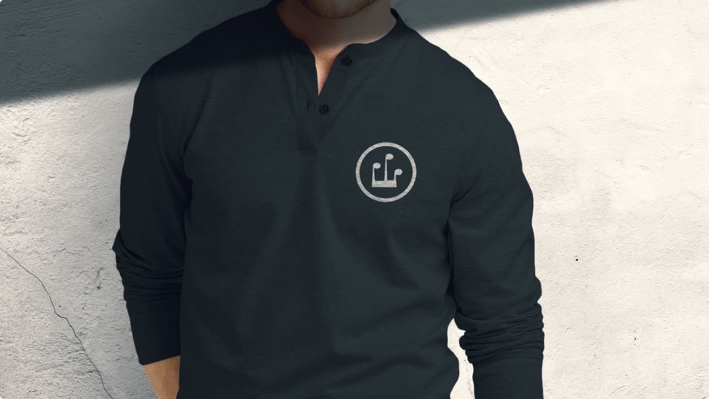 Brand apparel mockup — long-sleeve henley with an embossed circular logo