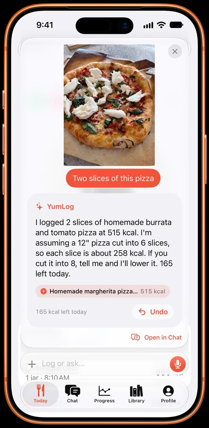 iPhone showing YumLog logging two slices of pizza from a photo.