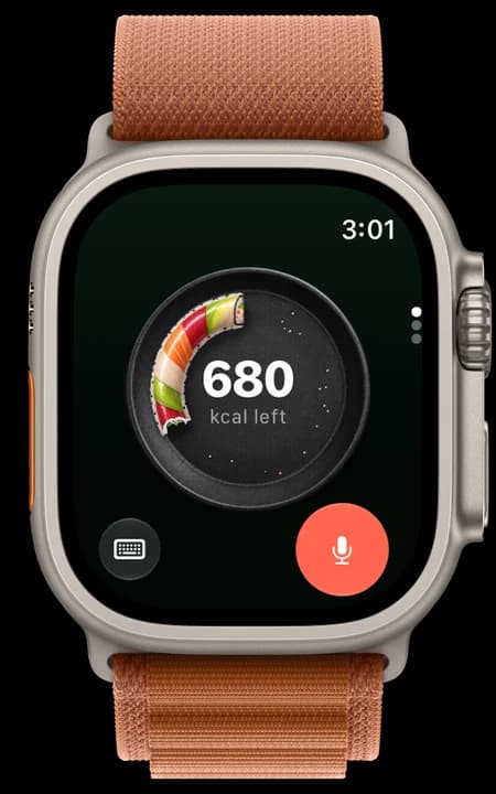 Apple Watch Ultra showing YumLog: 680 kcal left, on a ring of sushi on a dark plate, with a keyboard button and a coral mic.